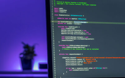 Laptop with Coding on Screen
